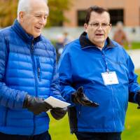 two men catch up while on campus tour